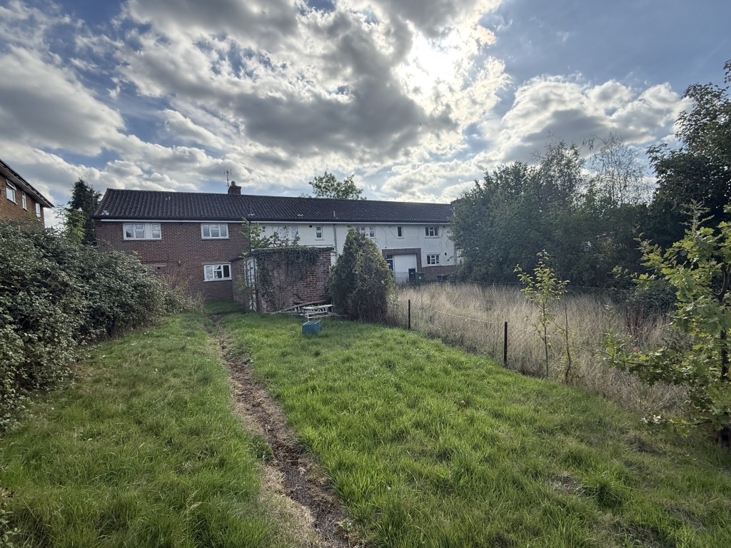 Lot: 136 - BLOCK OF FLATS FOR IMPROVEMENT ON 0.51 ACRE PLOT AND POTENTIAL FOR DEVELOPMENT - View from Rear Boundary of Block of Eight Flats